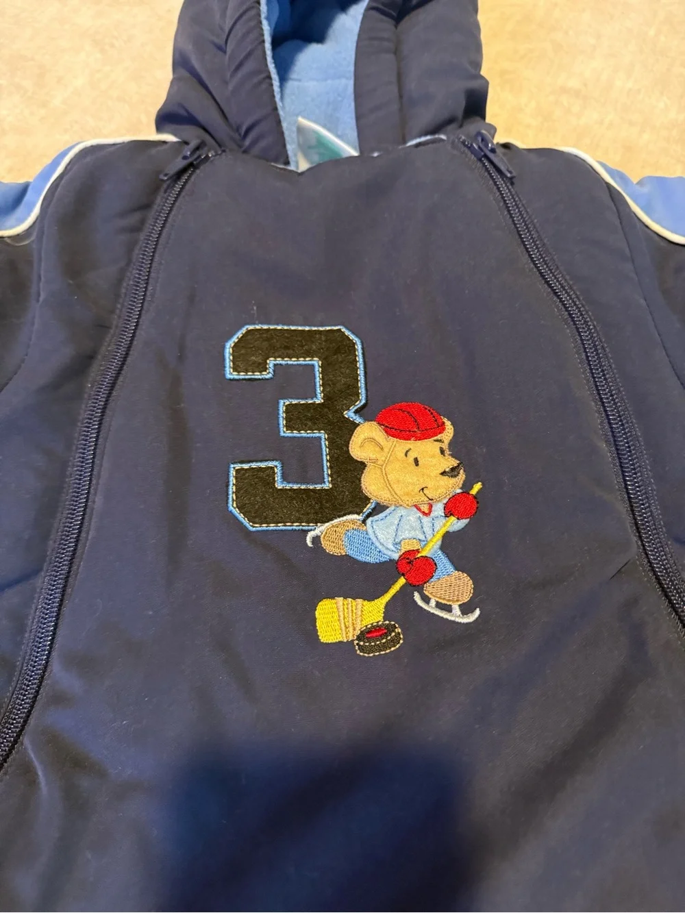 okie dokie Navy and Light Blue Hooded Baby One-Piece Snowsuit Hockey Bear